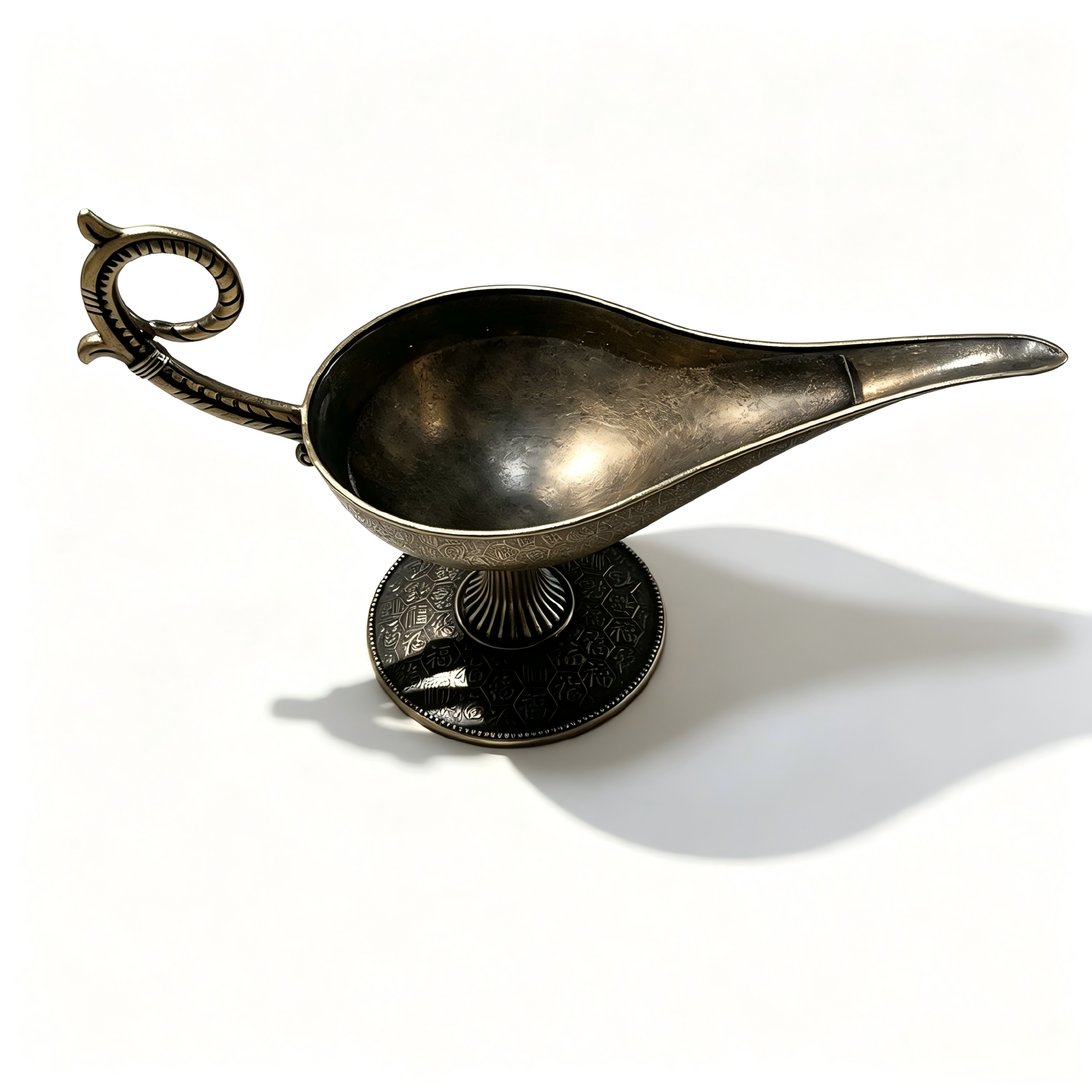 An overhead exploded view of the antique bronze Aladdin lamp incense burner, showcasing the open ash basin layered with fine black incense sand, the detached intricate filigree lid, and a natural brown coil incense beneath on a pure white background.