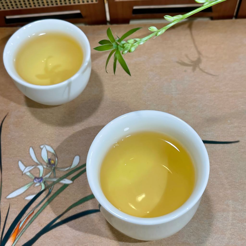 cup of white peony tea with light golden color