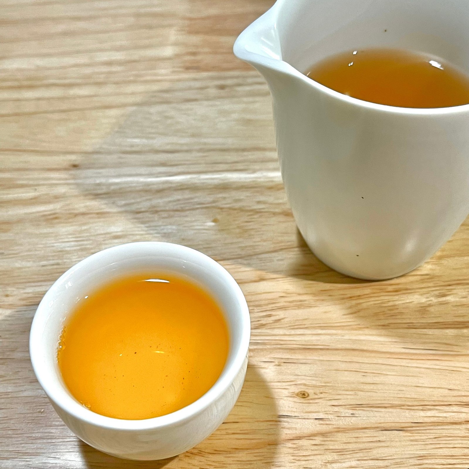 Apricot-yellow tea liquor from 2023 Phoenix Mountain Raw Puerh Tuocha 3 years aged brewed Gongfu