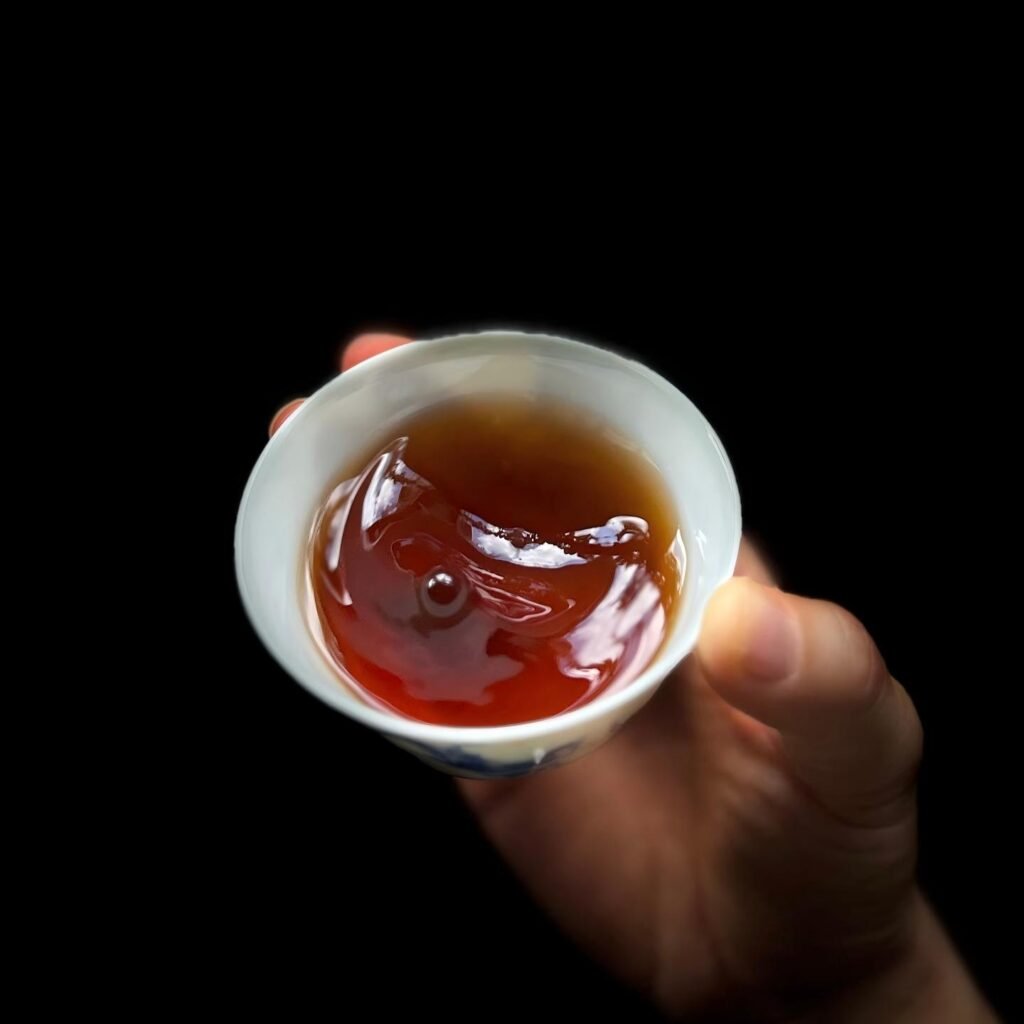 Deep ruby red glowing tea liquor from 2021 Lincang aged Shou Puerh Tuocha 2 years loose-leaf aged"