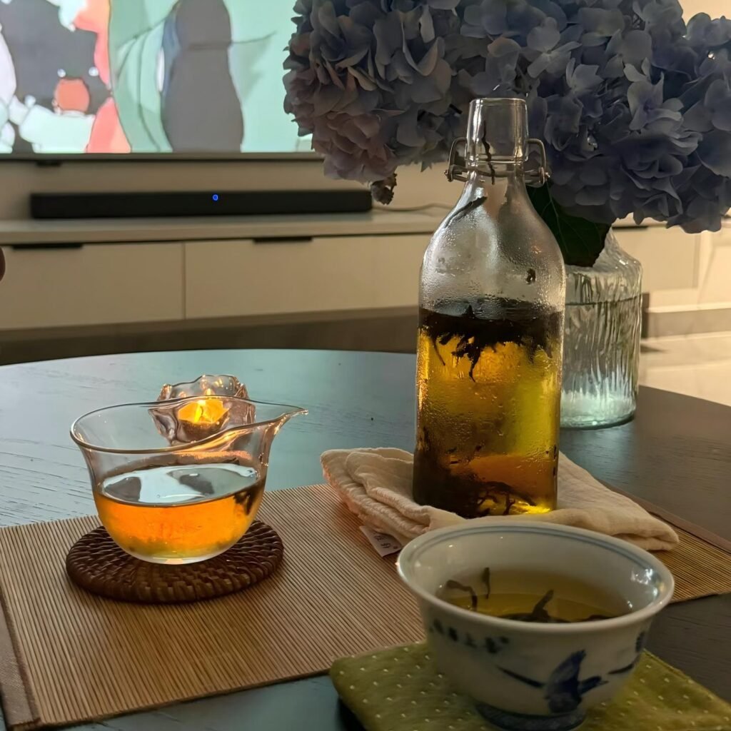 Xiaocai Black Tea cold brewed over ice with a mint sprig
